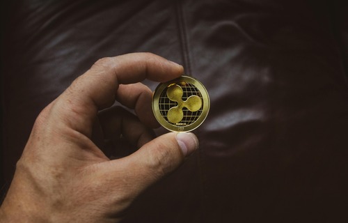 Gold Bitcoin coins representing BTC to USD conversion reference values