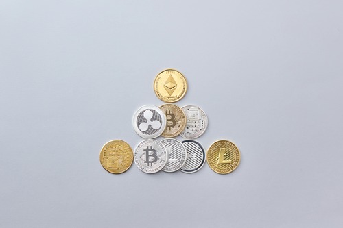 Laptop showing cryptocurrency exchange interface for converting BTC to USD